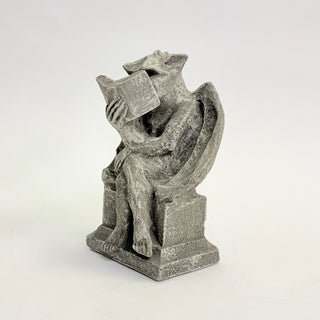 A seated gargoyle reading a book with legs crossed on a white background
House Parts home decor handmade Atlanta gargoyle grotesque whimsical fantasy mystical creature. Unique gift for fans of fantasy, dungeon, or dinosaurs. Unique Christmas gift for someone who has everything or fantasy lovers. Gothic, medieval, unique, artisan, craft, detail, specialty, a gift that no one else has, special, protective, female owned business, family small business, odd, quirky gifts