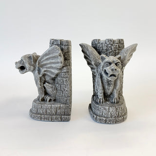 A pair of Castle Guardian Gargoyle bookends in front of a castle tower on a white background with one facing forward and the other one showing a side view.
House Parts home decor handmade Atlanta gargoyle grotesque whimsical fantasy mystical creature. Unique gift for fans of fantasy, dungeon, or dinosaurs. Unique Christmas gift for someone who has everything or fantasy lovers. Gothic, medieval, unique, artisan, craft, detail, specialty, a gift that no one else has, special, protective
