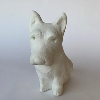 A white plaster sculpture of a Terrier sitting on his hind legs as he looks upward.  
Set on a white background

House Parts handmade, crafted, artisan, high quality, statues, busts, and figurines.  Unique gifts for everyone. Indoor decorations, Outdoor statues and garden items. Thoughtful gift, animal lovers, rabbit lovers, instead of pet, small business rabbit, bunny, dog, turtle, frog, clam shell, animal lover gifts, pet memorial