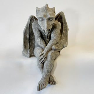 Seated with legs hanging over the edge Drysdale Dragon Gargoyle.  

House Parts home decor handmade Atlanta gargoyle grotesque whimsical fantasy mystical creature. Unique gift for fans of fantasy, dungeon, or dinosaurs. Unique Christmas gift for someone who has everything. Gothic, medieval, unique, artisan, craft, detail, specialty, a gift that no one else has, special, protective, female owned business, family small business, local, odd, quirky gifts