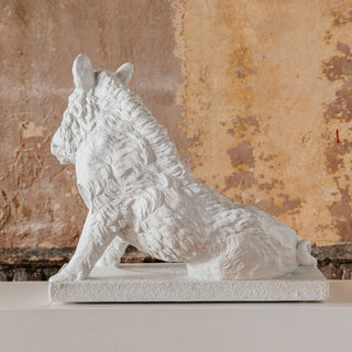 Rear view of a white plaster sculpture of a reclining boar on a textured base against a rustic background.  

House Parts handmade, crafted, artisan, high quality, statues, busts, and figurines.  Unique gifts for everyone. Indoor decorations, Outdoor statues and garden items. Thoughtful gift, animal lovers, rabbit lovers, instead of pet, small business, female owned family business, rabbit, bunny, dog, turtle, frog, clam shell