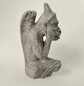 Another side view of a Gargoyle figurine has his hands on his face and is deep in thought.  The figurine is on a white background. House Parts home decor handmade Atlanta gargoyle grotesque whimsical fantasy mystical creature. Unique gift for fans of fantasy, dungeon, or dinosaurs. Unique Christmas gift for someone who has everything. Gothic, medieval, unique, artisan, craft, detail, specialty, a gift that no one else has, special, protective, female owned business, family small business, local, odd, quirky