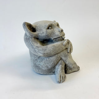 Another side view of a sitting cement gargoyle statue with his tongue sticking out on a white background. House Parts home decor handmade Atlanta gargoyle grotesque whimsical fantasy mystical creature. Unique gift for fans of fantasy, dungeon, or dinosaurs. Unique Christmas gift for someone who has everything. Gothic, medieval, unique, artisan, craft, detail, specialty, a gift that no one else has, special, protective, female owned business, family small business, local, odd, quirky gifts