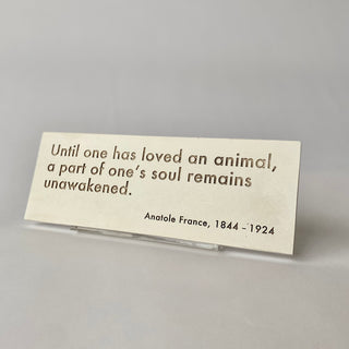 Plaque with shadowed text with quote from Anatole France "Until one has loved an animal, a part of one's soul remains unawakened." Fossil finish

House Parts handmade, crafted, artisan, high quality, statues, busts, and garden and animal figurines.  Unique gifts for everyone. Indoor decorations, Outdoor statues and garden items. Fantasy, whimsical, thoughtful gifts, original gift idea, shop small business, plaster, concrete, Clam shell, Gargoyles, Alice in Wonderland, animal lover gifts, pet memorial