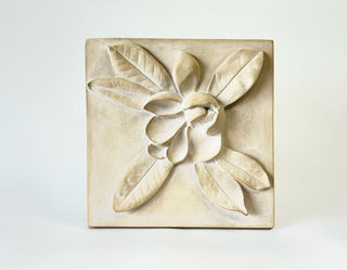 A white plaster cast of a Magnolia bud with leaf details, designed as wall art for home decor.

House Parts handmade, crafted, artisan, high quality, statues, busts, and garden and animal figurines.  Unique gifts for everyone. Indoor decorations, Outdoor statues and garden items. Fantasy, whimsical, thoughtful gifts, original gift idea, shop small business, plaster, concrete, Clam shell, Gargoyles, Alice in Wonderland, animal lover gifts, pet memorial