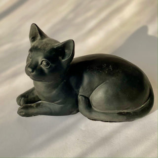 A black plaster statue of a resting cat, with his tail wrapped around his side, head and ears at attention and paws out front

House Parts handmade, crafted, artisan, high quality, statues, busts, and figurines.  Unique gifts for everyone. Indoor decorations, Outdoor statues and garden items. Thoughtful gift, animal lovers, rabbit lovers, instead of pet, small business rabbit, bunny, dog, turtle, frog, clam shell, animal lover gifts, pet memorial