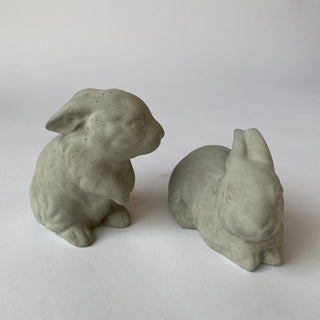 Two concrete bunny sculptures on a white background, one facing left and one facing right.

House Parts handmade, crafted, artisan, high quality, statues, busts, and figurines.  Unique gifts for everyone. Indoor decorations, Outdoor statues and garden items. Thoughtful gift, small business, female owned family business