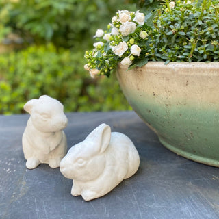 Two rabbit figurines next to a potted plant on a slate tabletop.  There is greenery slightly blurred in the background

House Parts handmade, crafted, artisan, high quality, statues, busts, and figurines.  Unique gifts for everyone. Indoor decorations, Outdoor statues and garden items. Thoughtful gift, animal lovers, rabbit lovers, instead of pet, small business, female owned family business