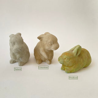 Three plaster rabbit or bunny figurines in different finishes 'Natural', 'Limestone', and 'Oxidized' on a white background.

House Parts handmade, crafted, artisan, high quality, statues, busts, and figurines.  Unique gifts for everyone. Indoor decorations, Outdoor statues and garden items. Thoughtful gift, animal lovers, rabbit lovers, instead of pet, small business, female owned family business, rabbit, bunny, dog, turtle, frog, clam shell