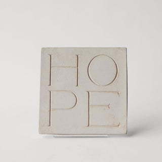A rectangular concrete path stone with the word 'Hope' carved on it, placed on a white background. A beautiful message for all.

House Parts handmade, crafted, artisan, high quality, statues, busts, and garden and animal figurines.  Unique gifts for everyone. Indoor decorations, Outdoor statues and garden items. Fantasy, whimsical, thoughtful gifts, original gift idea, shop small business, plaster, concrete, Clam shell, Gargoyles, Alice in Wonderland, animal lover gifts, pet memorial