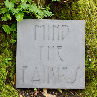 Mind the Fairies steppingstone against some green moss at the base of a tree

House Parts handmade, crafted, artisan, high quality, statues, busts, and garden and animal figurines.  Unique gifts for everyone. Indoor decorations, Outdoor statues and garden items. Fantasy, whimsical, thoughtful gifts, original gift idea, shop small business, plaster, concrete, Clam shell, Gargoyles, Alice in Wonderland, animal lover gifts, pet memorial