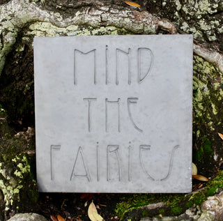 Mind the Fairies steppingstone against the bark of tree

House Parts handmade, crafted, artisan, high quality, statues, busts, and garden and animal figurines.  Unique gifts for everyone. Indoor decorations, Outdoor statues and garden items. Fantasy, whimsical, thoughtful gifts, original gift idea, shop small business, plaster, concrete, Clam shell, Gargoyles, Alice in Wonderland, animal lover gifts, pet memorial