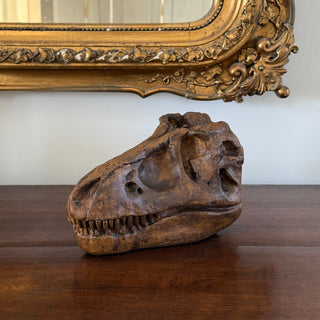 Fossilized dinosaur skull on a wooden surface with an ornate gold mirror in the background.

House Parts handmade, crafted, artisan, high quality, statues, busts, and figurines.  Unique gifts for everyone. Indoor decorations, Outdoor statues and garden items. Thoughtful gift, animal lovers, rabbit lovers, instead of pet, small business, female owned family business, rabbit, bunny, dog, turtle, frog, clam shell