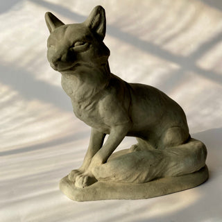 Sculpture of a proud valiant fox sitting up with ears raised.  His tail is resting on the base next to him. He has been photographed on a white background

House Parts handmade, crafted, artisan, high quality, statues, busts, and figurines.  Unique gifts for everyone. Indoor decorations, Outdoor statues and garden items. Thoughtful gift, animal lovers, rabbit lovers, instead of pet, small business, female owned family business, rabbit, bunny, dog, turtle, frog, clam shell