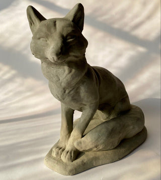 Close up view of a Sculpture of a proud valiant fox sitting up with ears raised.  His tail is resting on the base next to him. He has been photographed on a white background

House Parts handmade, crafted, artisan, high quality, statues, busts, and figurines.  Unique gifts for everyone. Indoor decorations, Outdoor statues and garden items. Thoughtful gift, animal lovers, rabbit lovers, instead of pet, small business, female owned family business, rabbit, bunny, dog, turtle, frog, clam shell